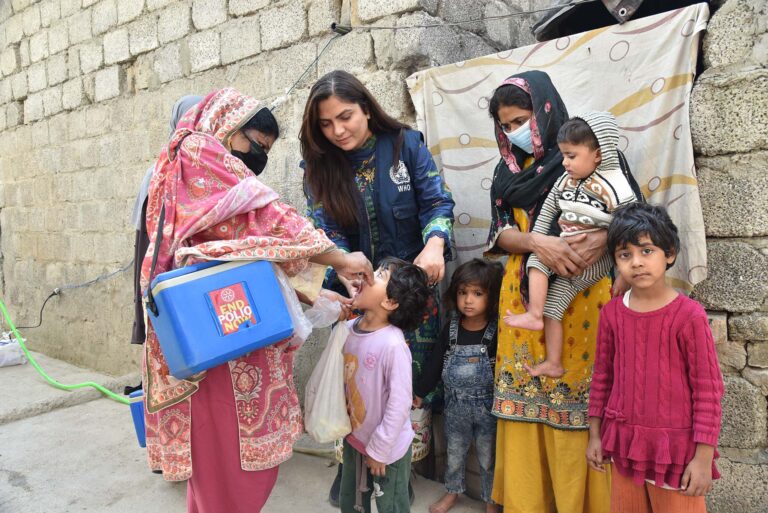 a who staff and a polio vaccinator during a vaccination campaign implemented in october 2025 in pakistan